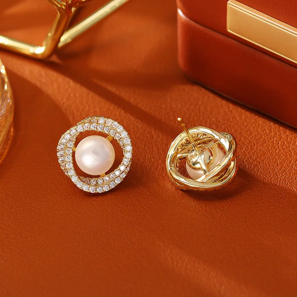 Natural pearl winding ear studs with real gold plating on copper base, geometric round shape