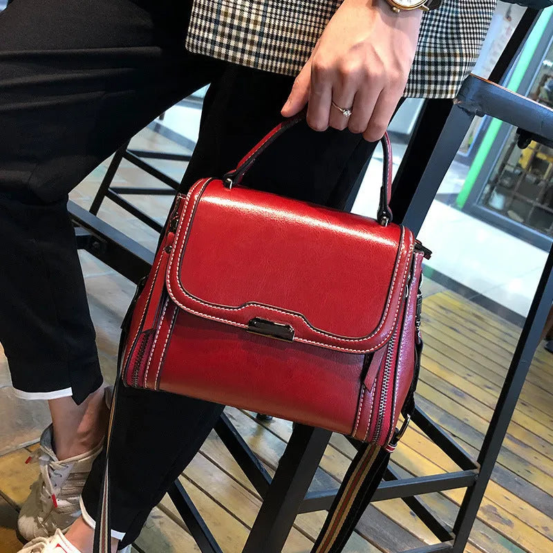Genuine leather women's vintage messenger bag with multiple internal compartments in caramel colour