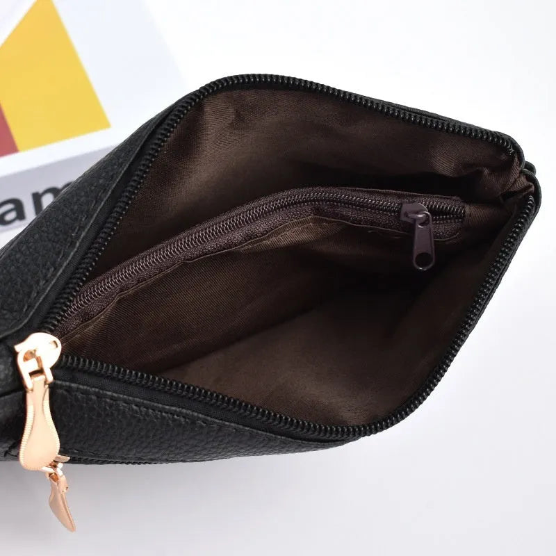 Soft PU leather crossbody bag in a square shape showing the internal sandwich zipper pocket.