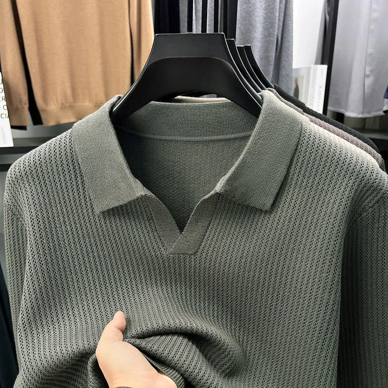 Man wearing a loose fit camel coloured casual pullover sweater.