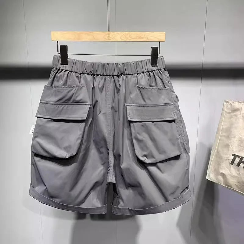 Men's large size work shorts with multiple pockets in black and grey colours