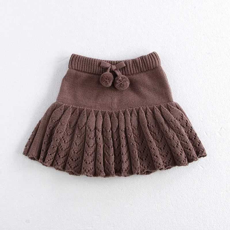 Girls hollow retro pleated pantskirt in light gray purple cotton, front view, on child of about 90cm height