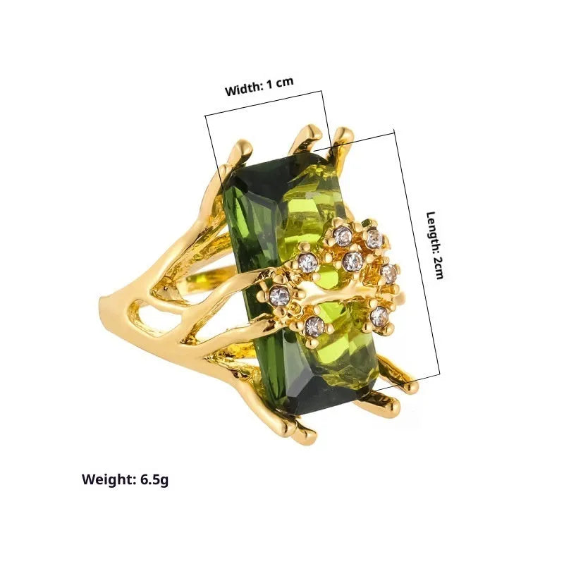 Lady's gold toned zinc alloy ring with navy blue inlaid diamond style stone