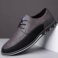Men's low-top casual leather shoes in black with a leather toe cap, decorative sewing lines, and a rubber sole.