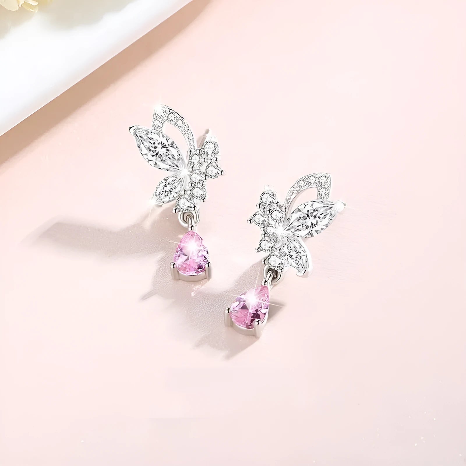 Women's silver butterfly stud earrings with crystal details on 925 sterling silver posts
