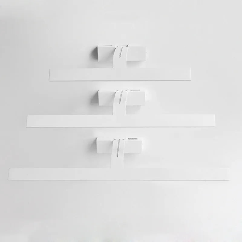 White LED illuminated bathroom mirror headlight mounted on wall, showing even light distribution across its length.