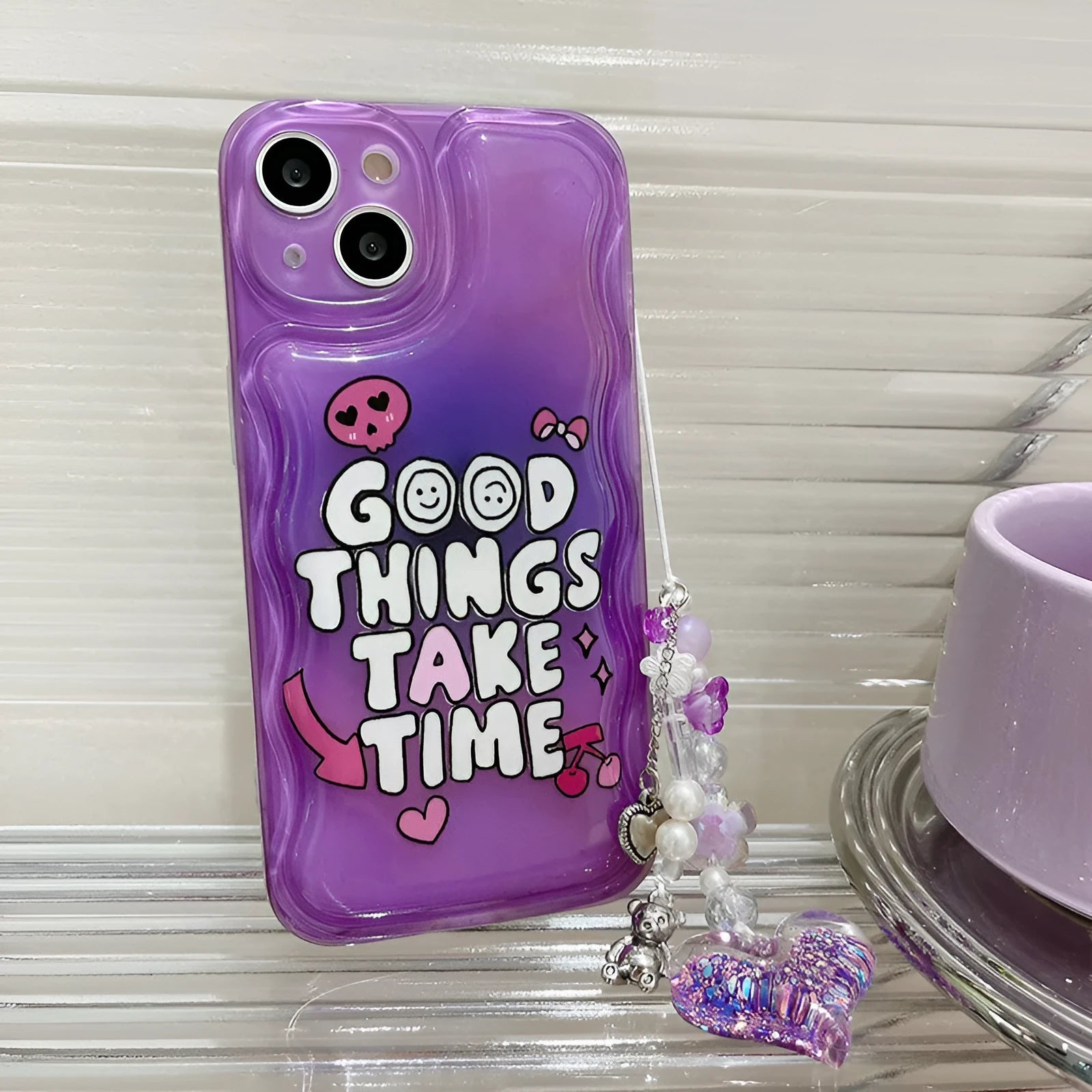 Purple graffiti and love pendant design iPhone case with a metal carrying chain attached.