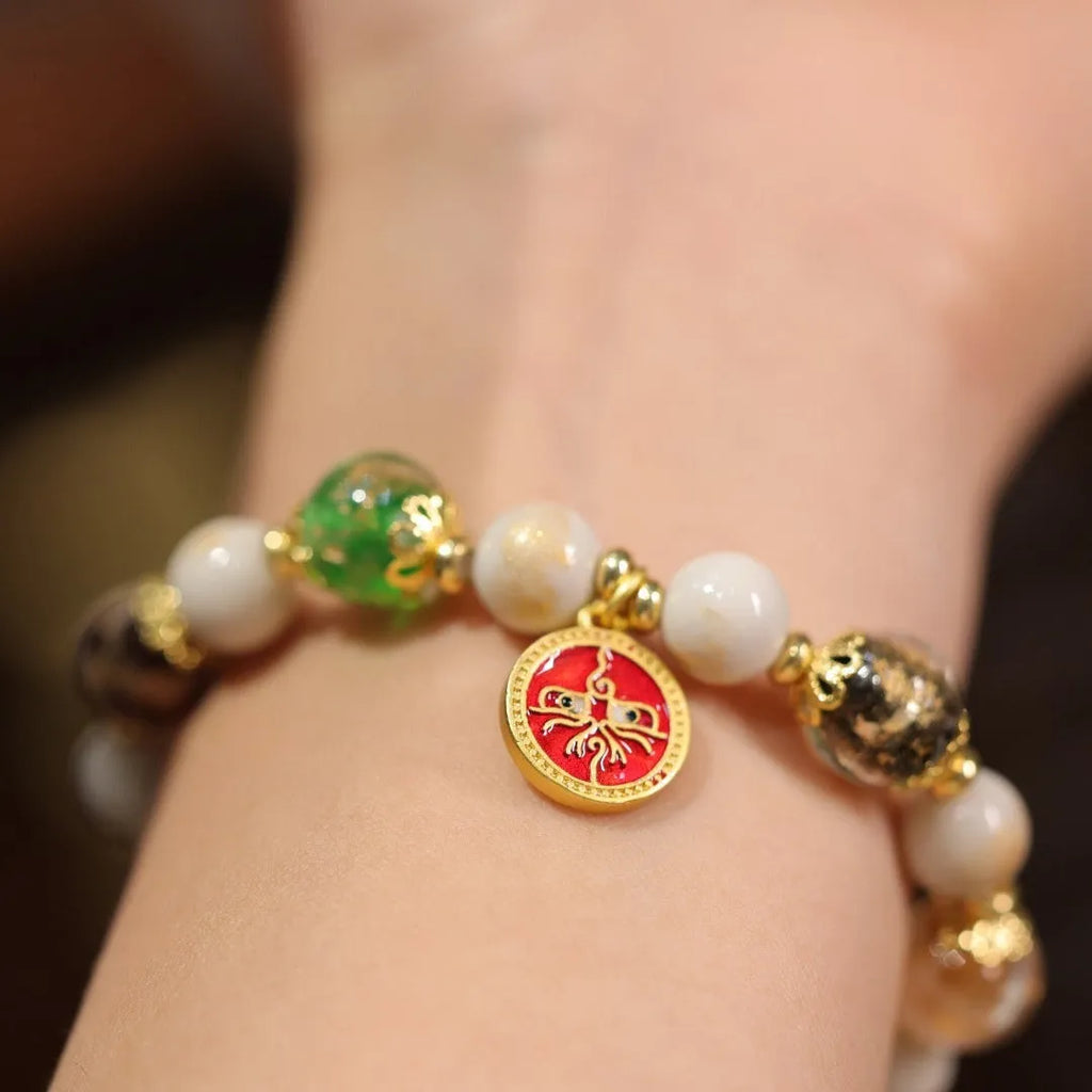 Fragrant Gray handmade glass bracelet with five Gods of Wealth design in coloured glaze.