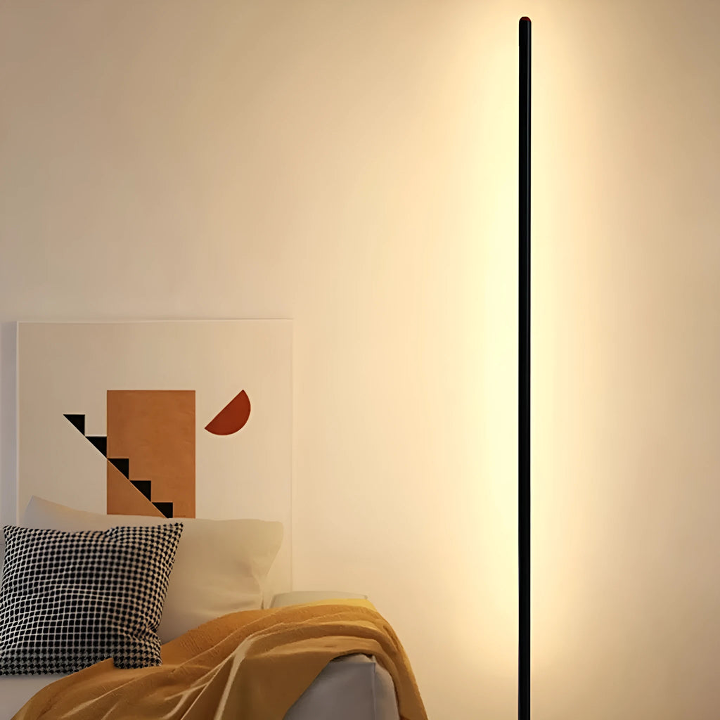 Simple vertical aluminium alloy floor lamp with a USB plug, shown beside a sofa.