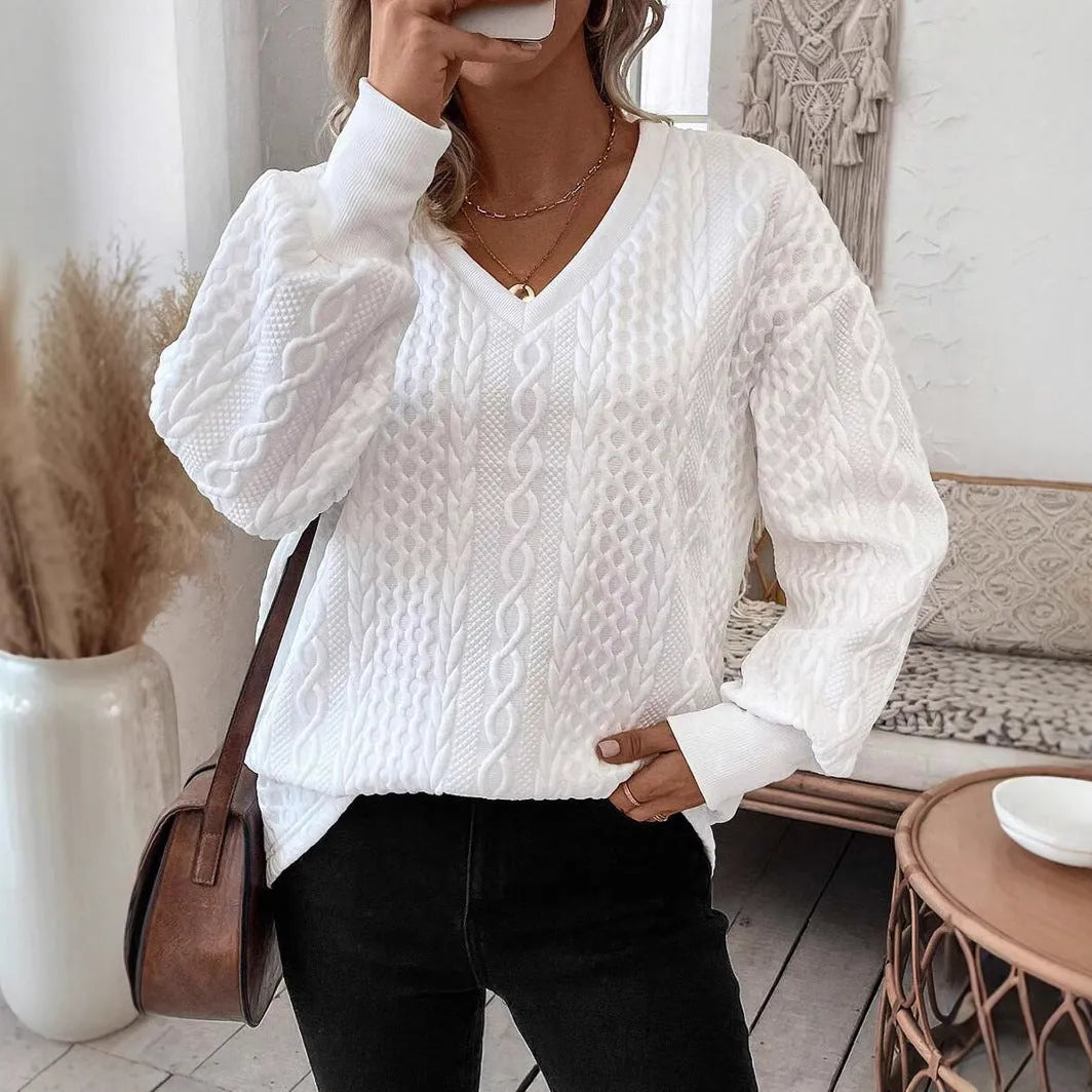 Milky white loose long sleeve T-shirt with a textured 3D pattern on the front.