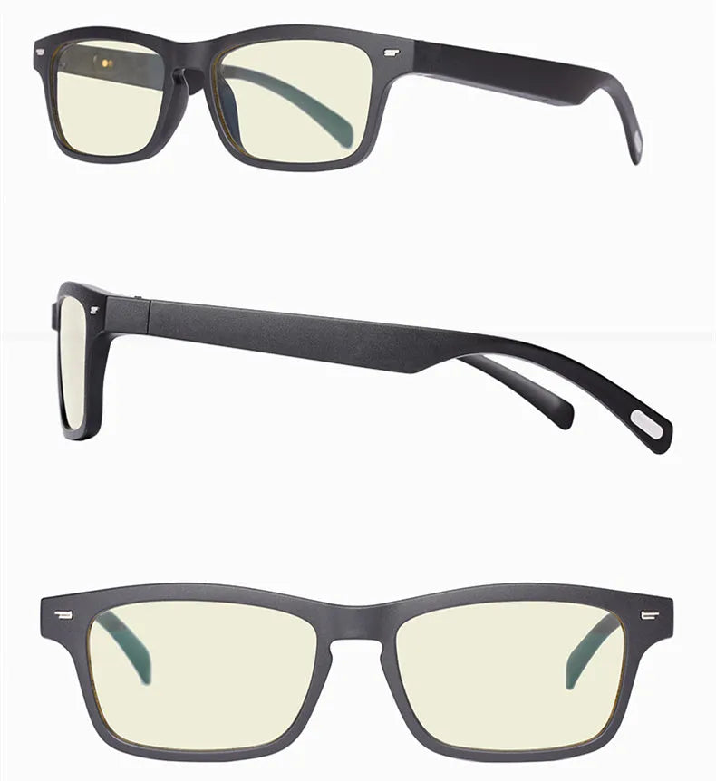 Smart Bluetooth audio glasses with dark lenses on a table, showing temple speakers and a charging case.
