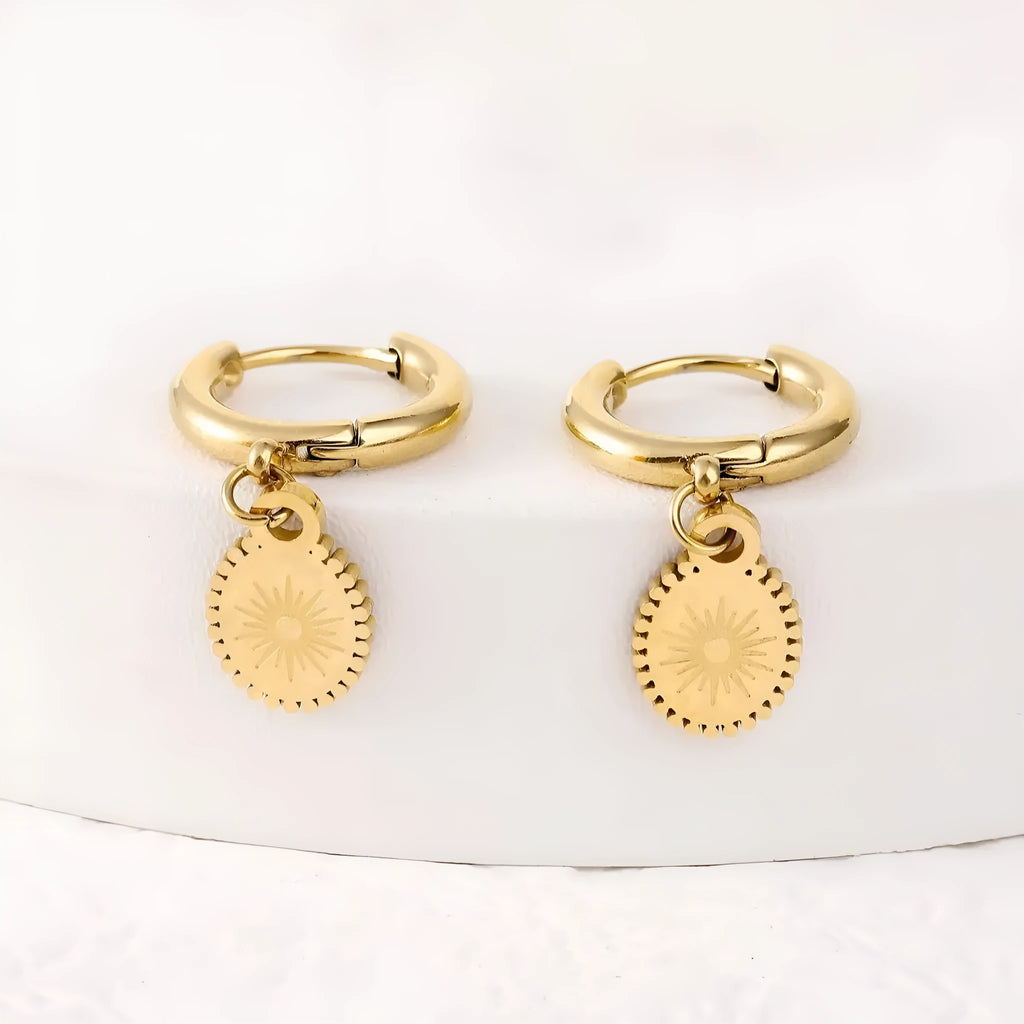 Women's geometric stainless steel earrings with oval accent shapes and ear button fastening