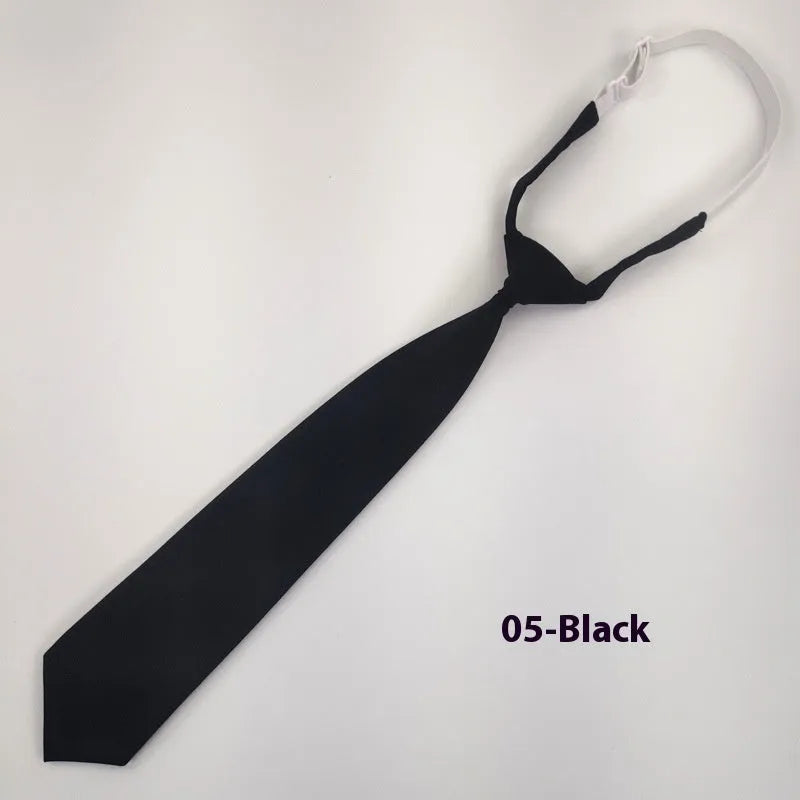 A navy blue cotton men's bow tie with an arrow style design on a white background.