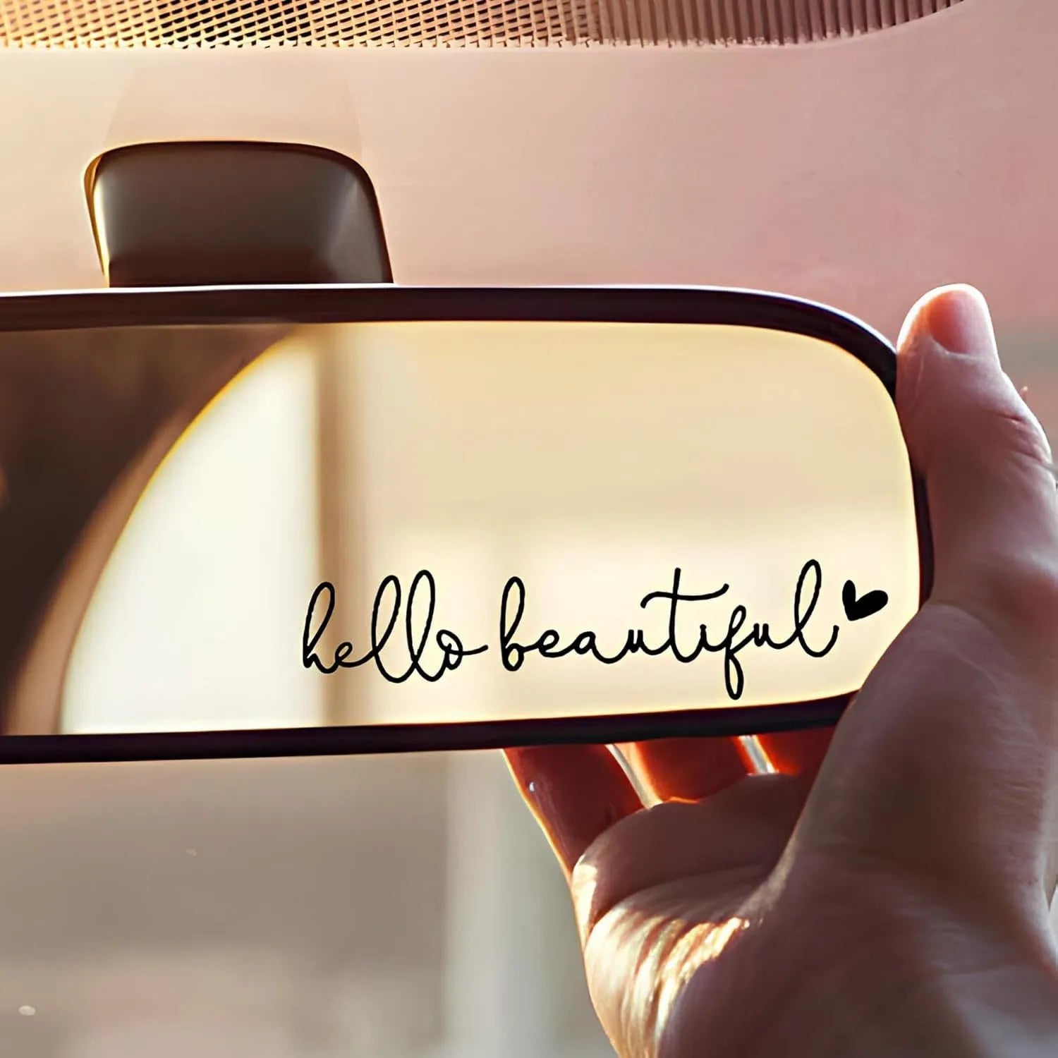 Plastic rearview mirror sticker 10x3cm in black on a car mirror
