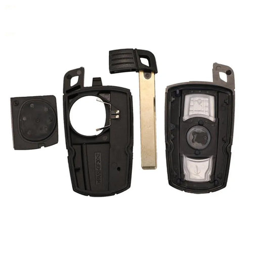 BMW semi-intelligent remote car key fob with three buttons, metal and plastic casing.