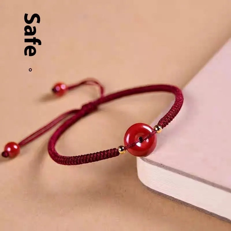 Cinnabar heart charm bracelet with adjustable red rope and traditional safety buckle in multiple colour options