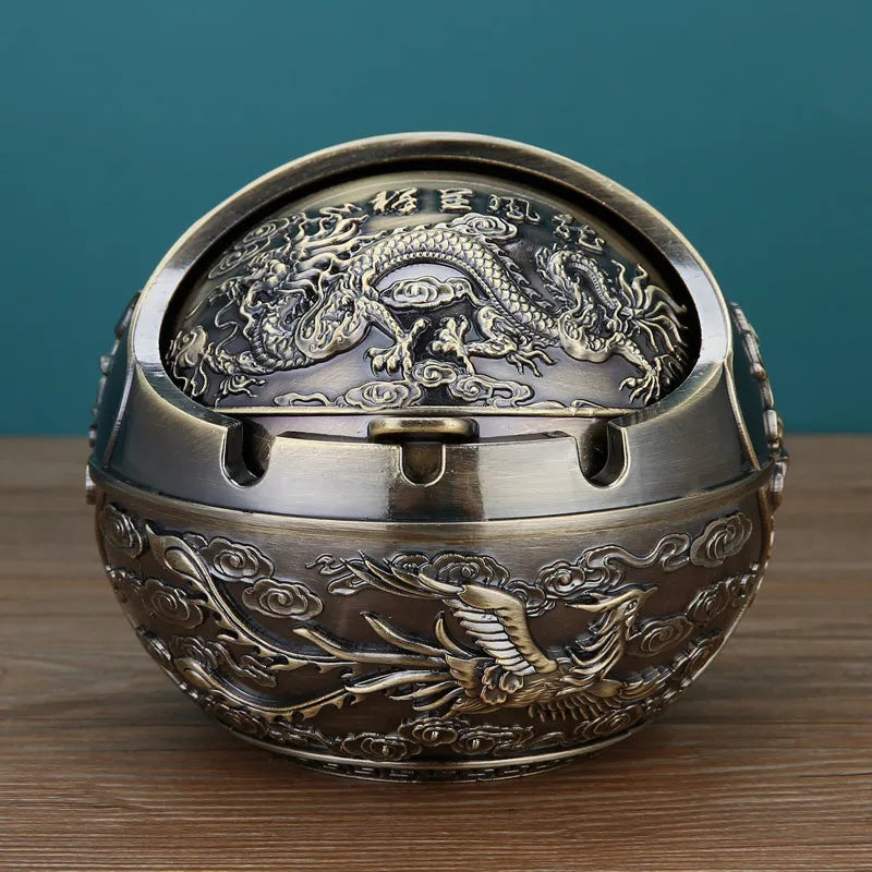 Bronze alloy ashtray with decorative fortune tree design and smoke extinguishing slot.