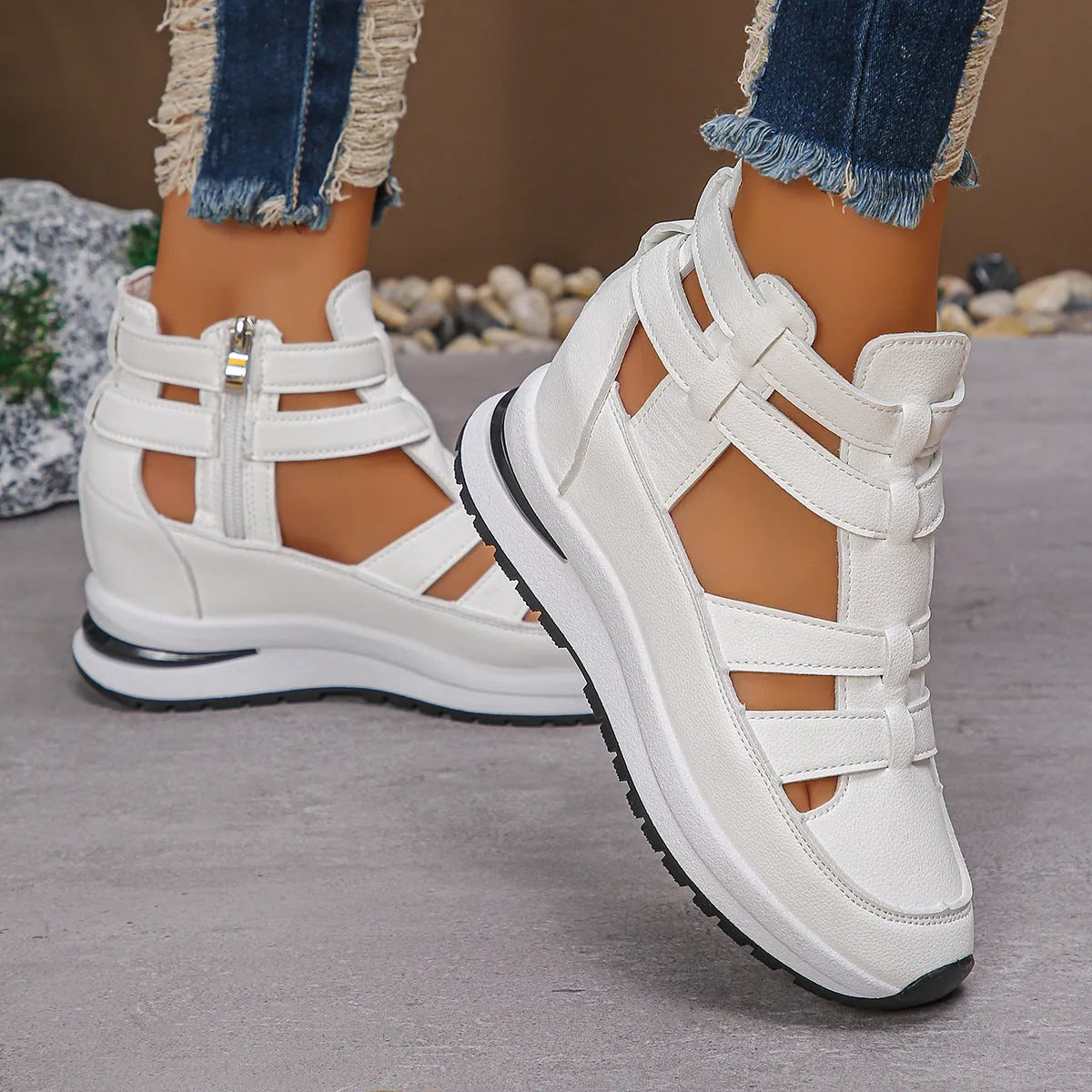 Women's black platform sandal with closed toe, hollow-out design, and Velcro ankle strap.