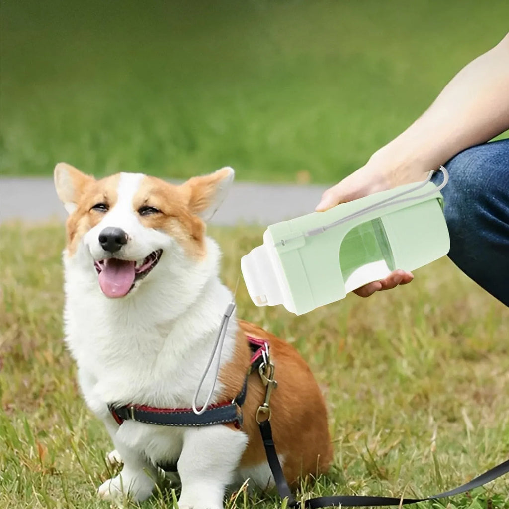 Green 2-in-1 travel dog water bottle with lanyard showing food and water compartments