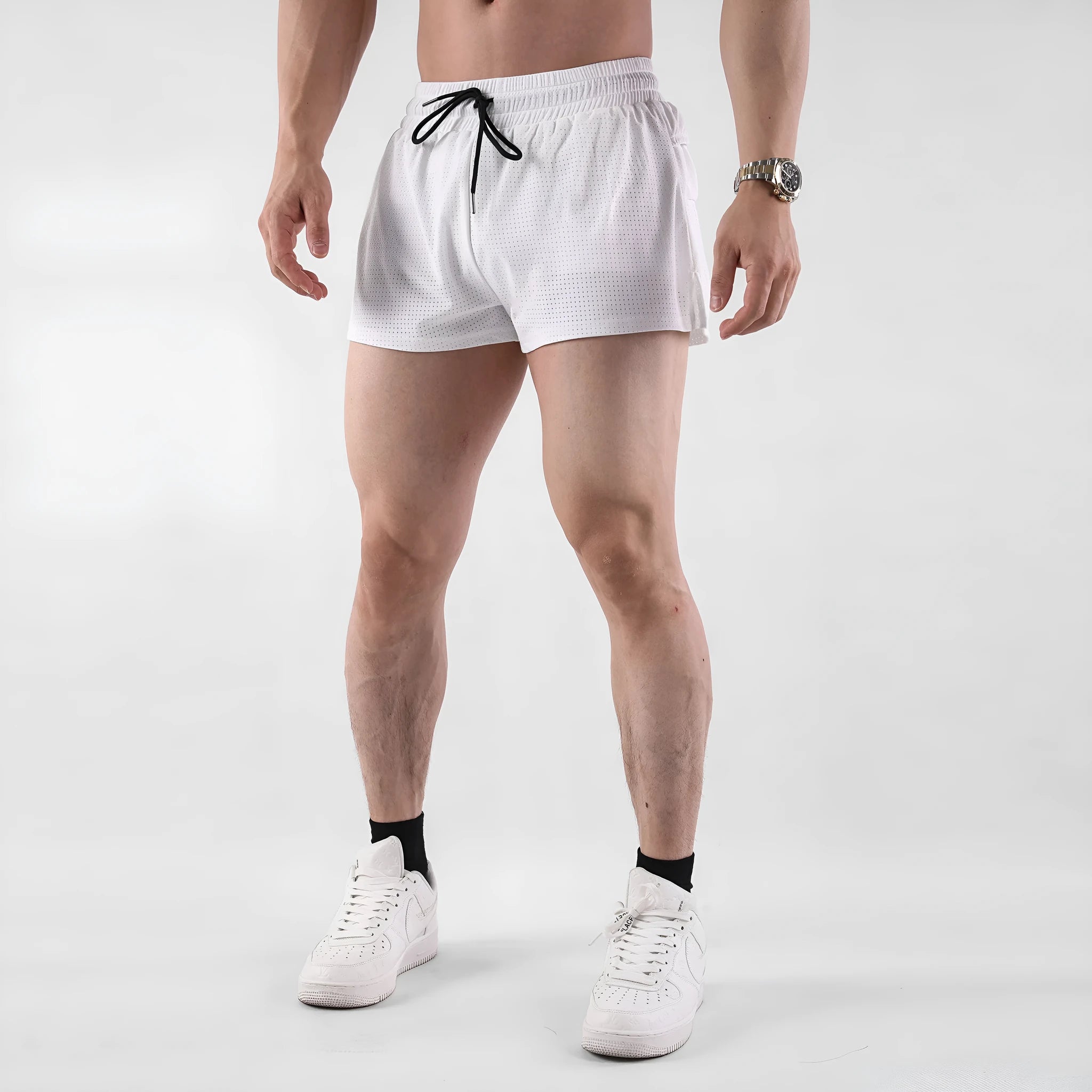 Men's black quick-drying nylon summer shorts with a mid waist and short length on a white background.