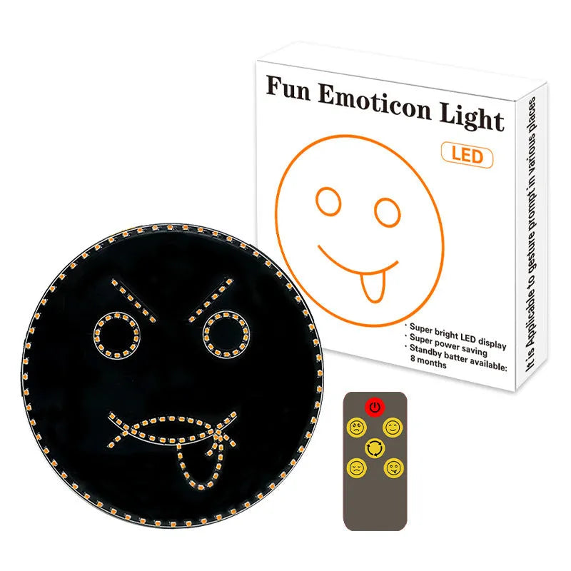 Black car rear window LED expression light showing smiley face design with orange illumination