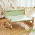 Wooden cat beach chair bed with blue cloth hammock suspended from frame