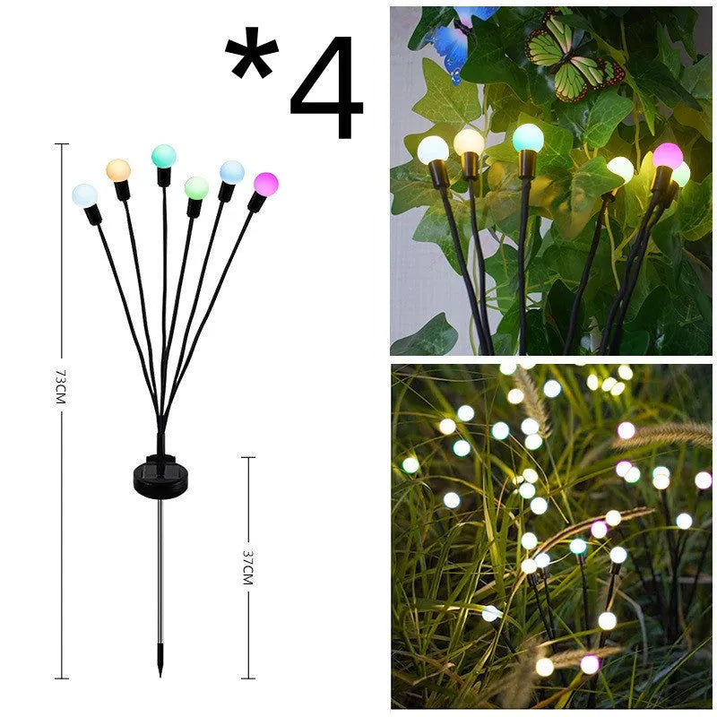 Solar-powered LED firefly garden spike light with multiple heads and a press-in ground plug on grass.