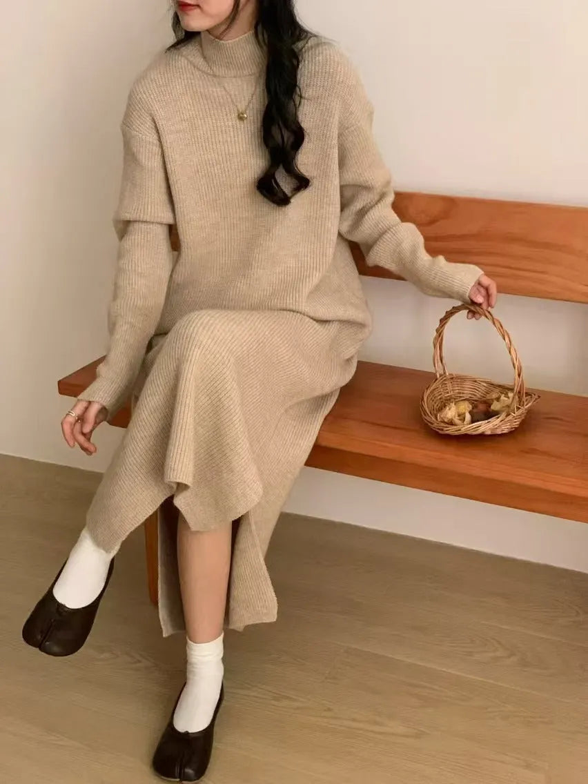 Woman wearing a milky white half turtleneck long sleeve knitted midi dress with a high waist.