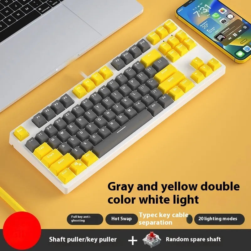 87-key wired mechanical keyboard with two-tone keycaps, shown with switch puller and cleaning brush