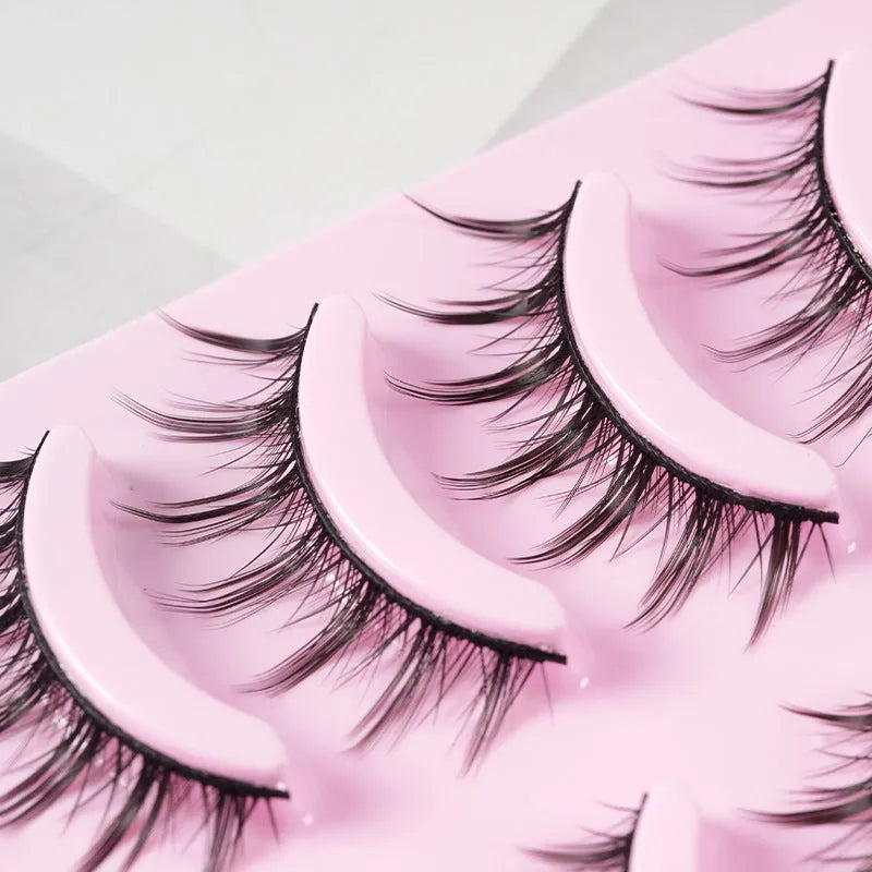 Set of manga style false eyelashes showing three wispy designs on a plastic black terrier base.