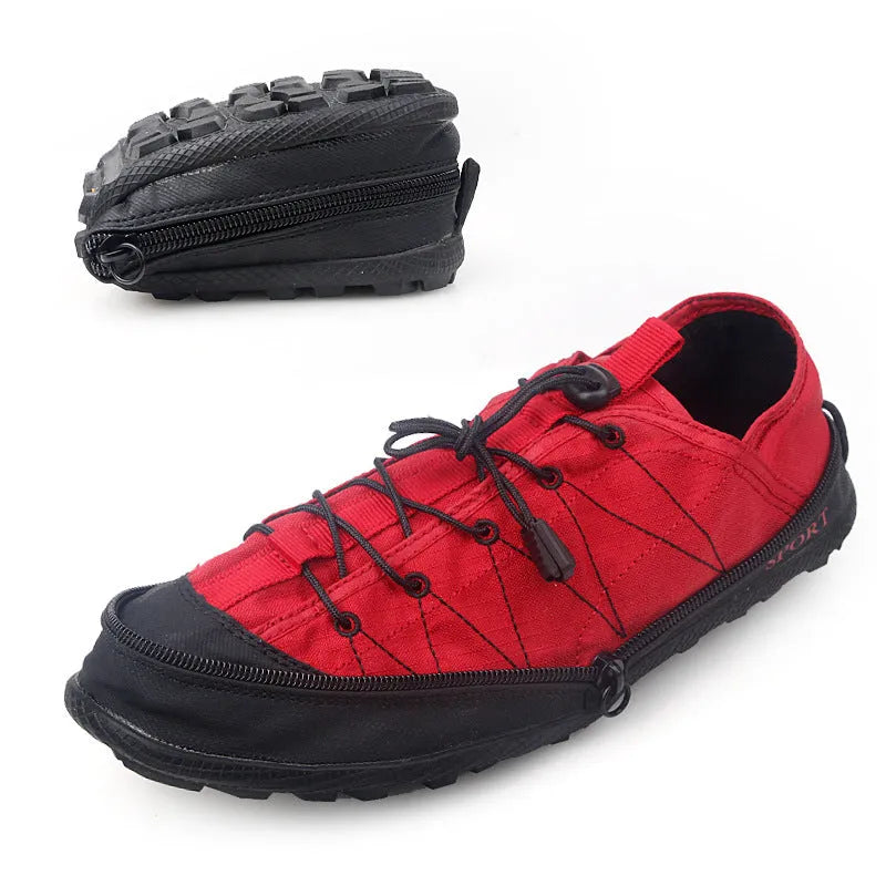 Orange folding outdoor hiking shoe with mesh upper and side zip closure laid flat.