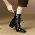 Women's black pointed-toe short boots with a 5.5cm heel and velvet finish on a neutral background.