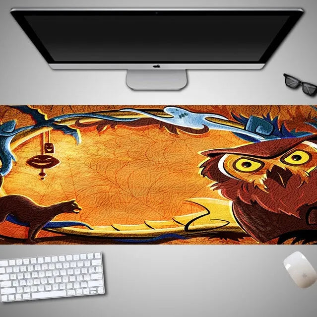 Large Halloween patterned gaming mouse pad on a desk showing non-slip rubber base and extra-long design.