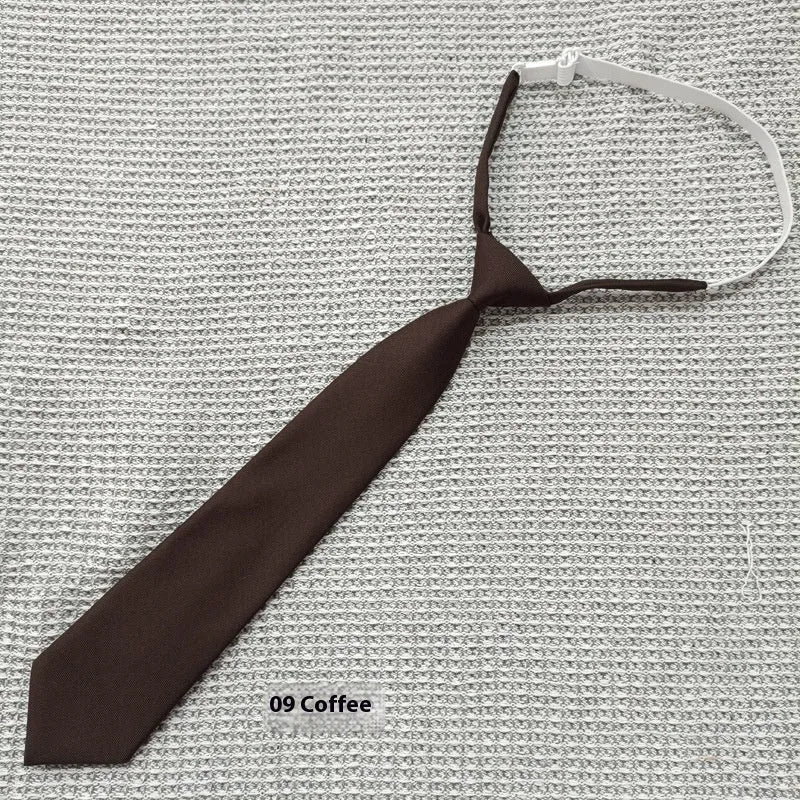 A navy blue cotton men's bow tie with an arrow style design on a white background.