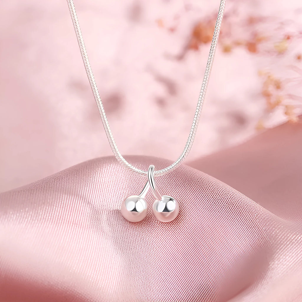 Silver cherry necklace for women on a snake bone chain, adjustable length.