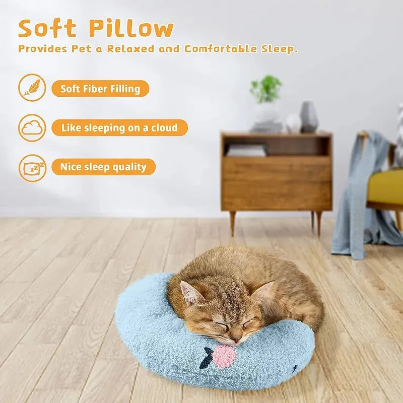 White U-shaped plush pet pillow for a small cat or dog on a grey background.