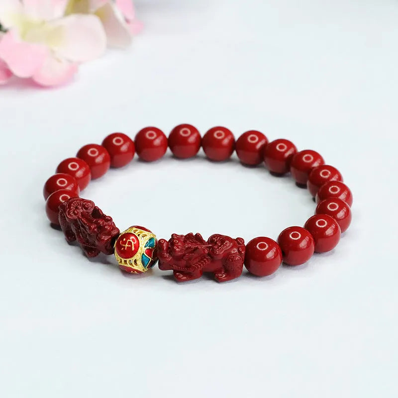 Close-up of a purple gold sand carved cinnabar women's bracelet with a double Pixiu design.