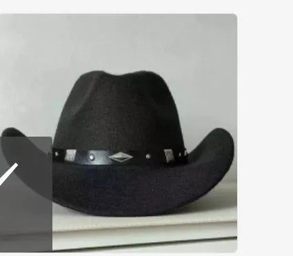 Brown leather velvet cowboy hat with curved brim and conical crown on a wooden post.