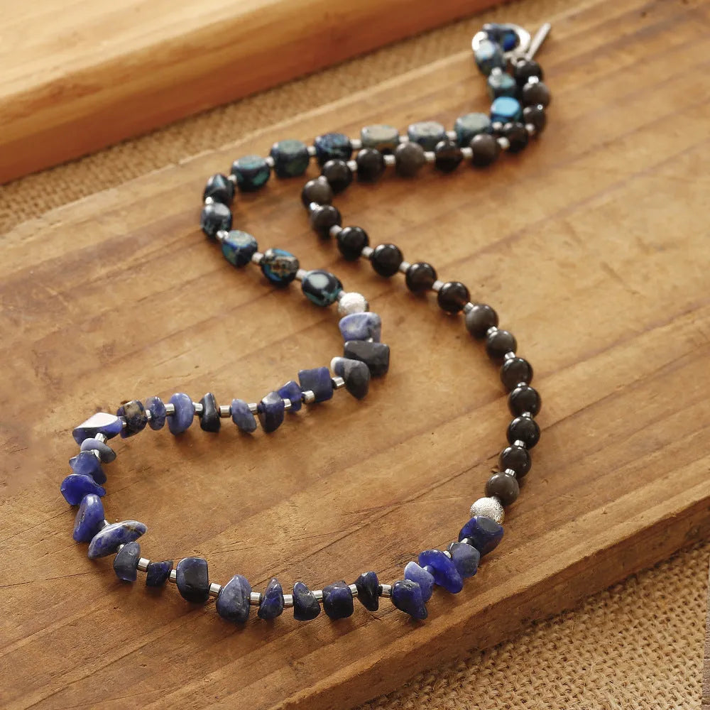 Blue hand-woven bracelet made from crushed Fang Hui stone and gold obsidian with geometric shapes