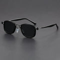 Retro square sunglasses with graphic lightning bolt design on black and gold frames.
