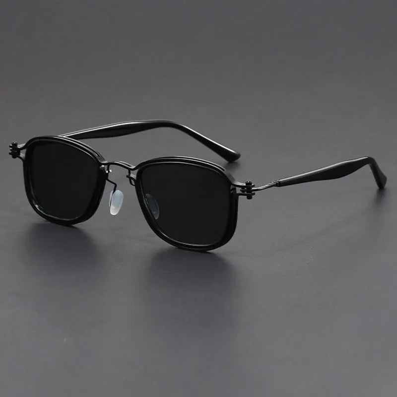 Retro square sunglasses with graphic lightning bolt design on black and gold frames.