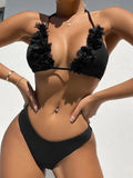 Black women's two-piece swimsuit set with gathered design, featuring a top and shorts.