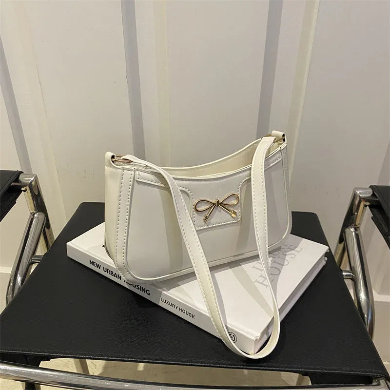 PU leather Western style baguette shoulder bag with bow detailing in six colour options