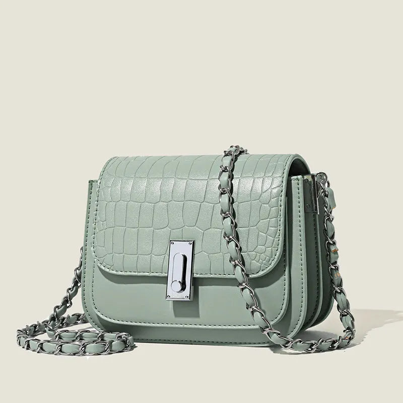 Soft black PU leather women's chain shoulder bag with adjustable strap and square shape.