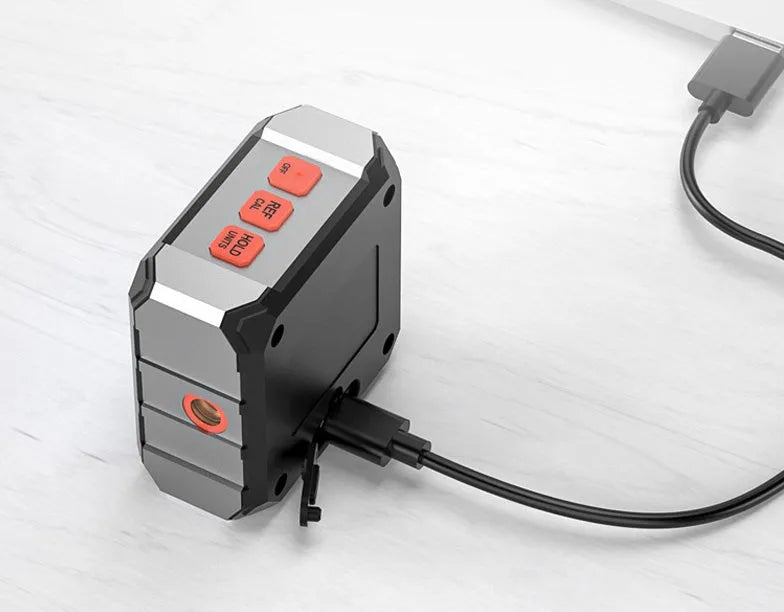 Longyun digital laser inclinometer with alloy casing and backlit display on a wooden workbench.