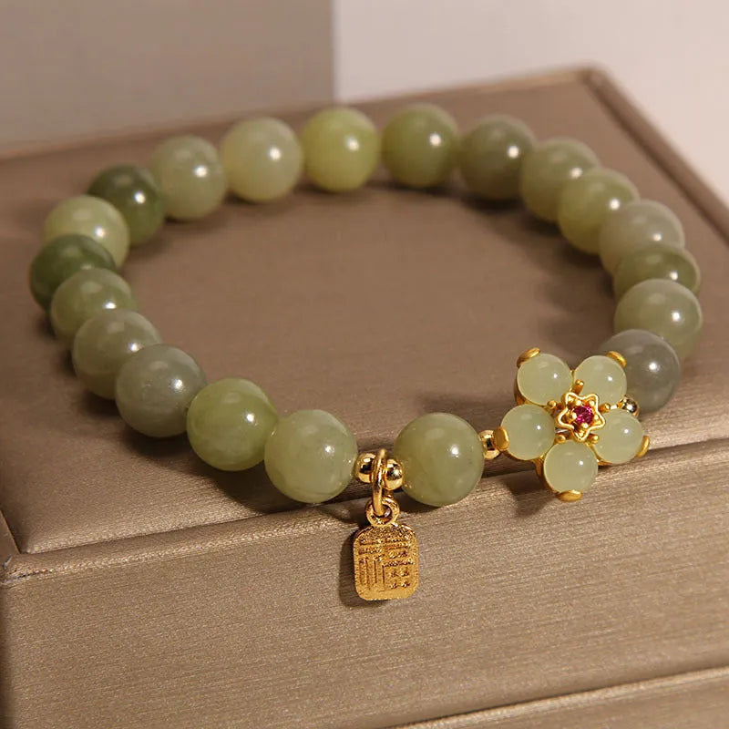 Women's casual fashion bracelet in a grey jade colour with alloy metal construction.