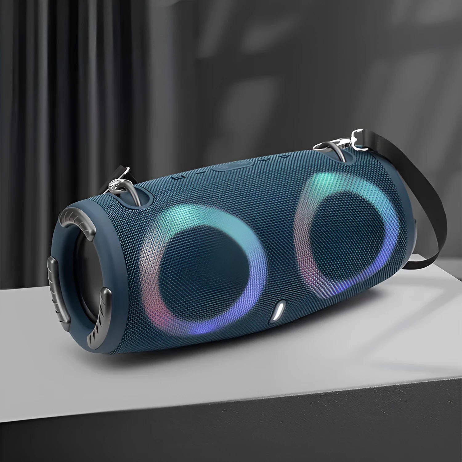 War Drum portable Bluetooth speaker with RGB lights in camouflage finish, showing carry strap and control buttons.
