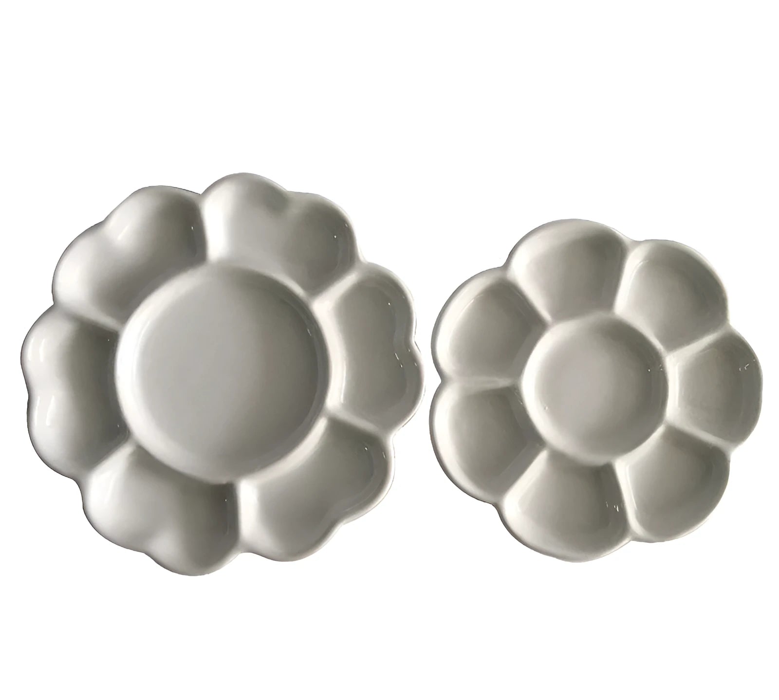 White hand-made ceramic plum blossom shaped artist palette for paint mixing.