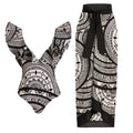 Women's vintage printed deep V-neck one-piece swimsuit with a matching wrap skirt laid flat.