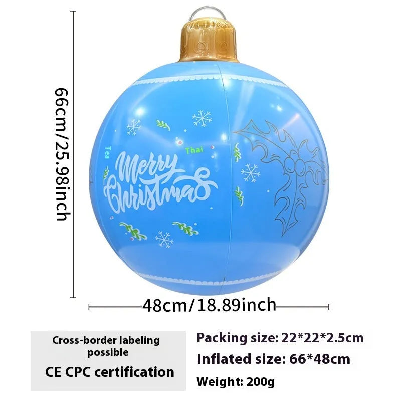 Large red and white inflatable Christmas ball with flashing lights in a garden setting